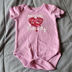 Melting hearts is my specialty onsie